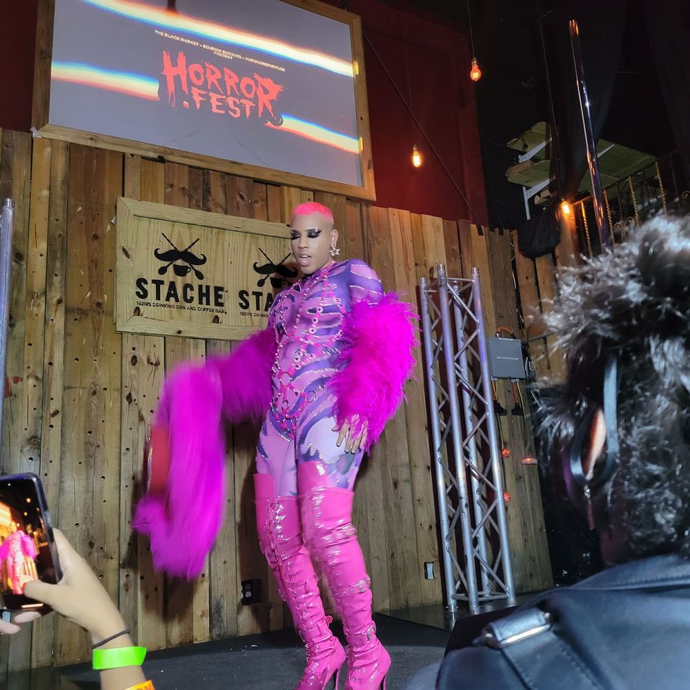 Stache Drinking Den  -  woman dressed in a purple outfit - Whiskey Bars Near Me - Fort Lauderdale, Florida