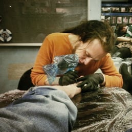 Getting my foot tattoo.