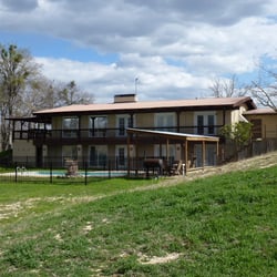 M&M Creekside Hill Country Retreat - This is the backside of the house, showing both levels and pool.