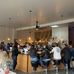 Alchemy Distillery - A view of the bar and kitchen from the outside bar seats