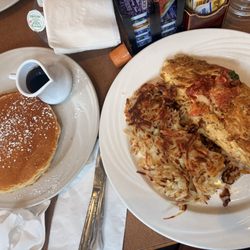 Fresca omelet with hash browns and pancakes on the side