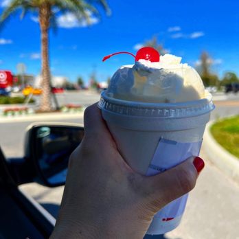 Chick-fil-A - ows a hand holding a cup of ice cream with a cherry on top - Fast Food Near Me - Orlando, Florida Chick-fil-A - ows a hand holding a cup of ice cream with a cherry on top - Fast Food Near Me - Orlando, Florida
