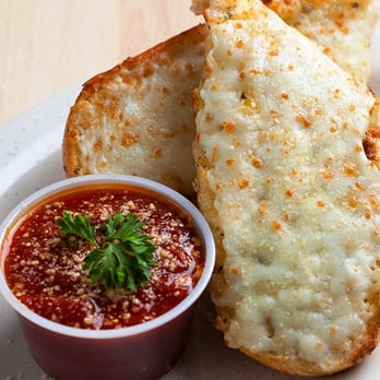 Pepperoni's Pizza - Rosenberg - two pieces of pizza on a plate with dipping sauce - Pizza Near Me - Rosenberg, Texas Pepperoni's Pizza - Rosenberg - two pieces of pizza on a plate with dipping sauce - Pizza Near Me - Rosenberg, Texas