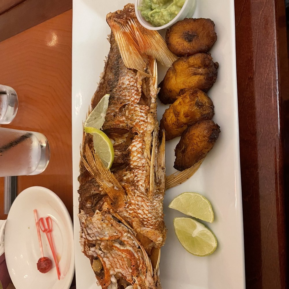 La Casona - Fried Tilapia with plantains and a side of Guacamole Fresco con Chips - Colombian Near Me - Central Falls, Rhode Island La Casona - Fried Tilapia with plantains and a side of Guacamole Fresco con Chips - Colombian Near Me - Central Falls, Rhode Island