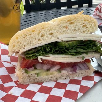 Caffe Capri - turkey sandwich on ciabatta with provolone, and cucumbers. - Coffee & Tea Near Me - Boise, Idaho Caffe Capri - turkey sandwich on ciabatta with provolone, and cucumbers. - Coffee & Tea Near Me - Boise, Idaho
