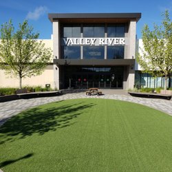 Valley River Center - Valley River Center entrance and outdoor plaza with seating and artificial turf.