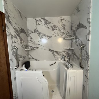 North Country Construction - a walk - in tub in a bathroom - General Contractors Near Me North Country Construction - a walk - in tub in a bathroom - General Contractors Near Me