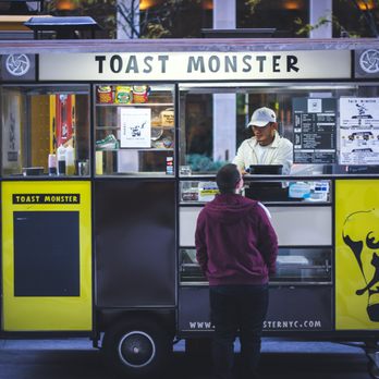 Toast Monster - a man standing in front of a food truck - Food Trucks Near Me Toast Monster - a man standing in front of a food truck - Food Trucks Near Me