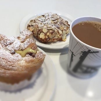 JJ Bean Coffee Roasters - a pastry and a cup of coffee - Coffee & Tea Near Me - North Vancouver, British Columbia