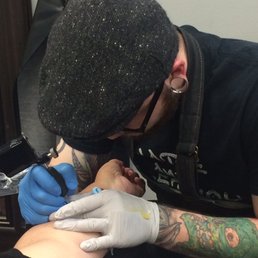 Kyle tattooing my aunt a few years ago!