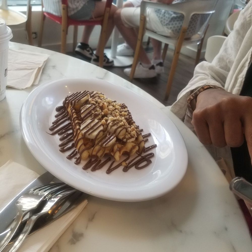 Nutella Cafe - Liege waffle with bananas, walnuts. - Desserts Near Me - Chicago, Illinois Nutella Cafe - Liege waffle with bananas, walnuts. - Desserts Near Me - Chicago, Illinois