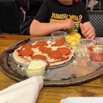 OV Pizza & Pints - My toddler building her Jr. Chef Pizza - Pizza Near Me - Oro Valley, Arizona OV Pizza & Pints - My toddler building her Jr. Chef Pizza - Pizza Near Me - Oro Valley, Arizona