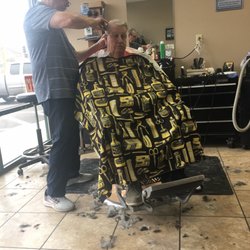 Reed's Barber Shops - Barber at work on a Friday