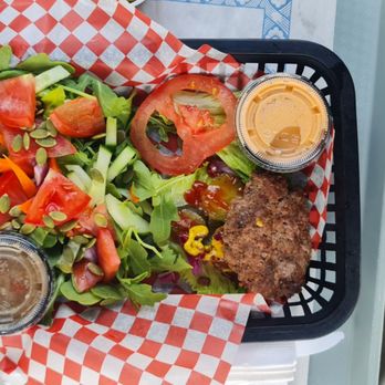 The South Shore Fish Shack - The world's tiniest hamburger. I put the take out tartar sayce container over it and you can not see the hamburger under it. - Seafood Near Me - Lunenburg, Nova Scotia The South Shore Fish Shack - The world's tiniest hamburger. I put the take out tartar sayce container over it and you can not see the hamburger under it. - Seafood Near Me - Lunenburg, Nova Scotia