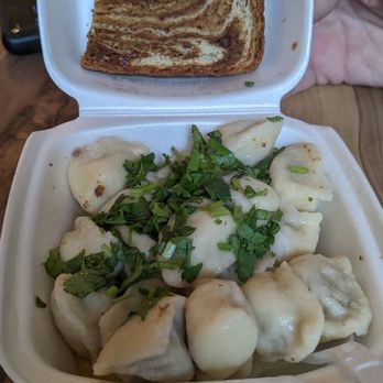 Pel'Meni - Beef dumplings with butter and cilantro and a slice of bread - Russian Near Me - Sitka, Alaska