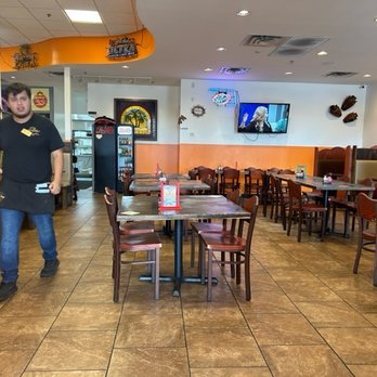 Los Mariachis - a man standing in a restaurant - Mexican Near Me - Broken Arrow, Oklahoma