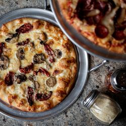 Cork N Crust - Specialty pizza at the Cork N Crust - fired on stone oven
