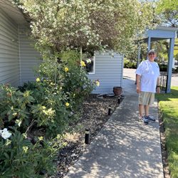 Holiday Rv Park - The side of the Clubhouse. There are roses and beautiful flowers everywhere.