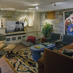 The Decorating Therapist - An unused basement with stone walls became a stylish and colorful family room.
