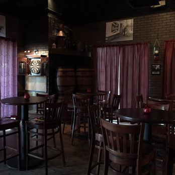 Repeal 18 - Table seating w dartboard - Cocktail Bars Near Me - Tampa, Florida Repeal 18 - Table seating w dartboard - Cocktail Bars Near Me - Tampa, Florida