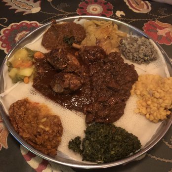 The Blue Nile - Chicken and beef selection with veggies on the outside circle - Ethiopian Near Me - Ferndale, Michigan