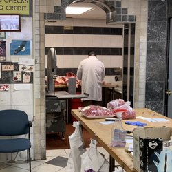 Quality Halal Market - A super nice and helpful butcher I forgot his name. Processing 4 legs of lamb for my doggies.