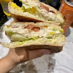 Safety Harbor Mobil Deli - Chicken salad sandwich on Cuban bread, pressed. Lettuce, onions, bacon, provolone, banana peppers, and ranch!