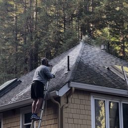 Treating the roof with moss remover Treating the roof with moss remover