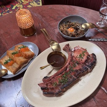 Le Coq - Pork tomahawk, pomme pave and mushrooms and onions - French Near Me - La Jolla, California
