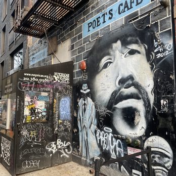 Nuyorican Poets Cafe - a mural of a man with a mustache - Bars Near Me - New York, New York