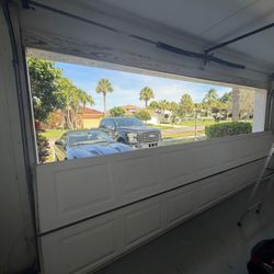 Sunset Garage Door Service - Before: Emergency Garage Door Repair Delray Beach Stuck with an off-track door? Sunset Garage Door is on-site for a fast, expert rescue.