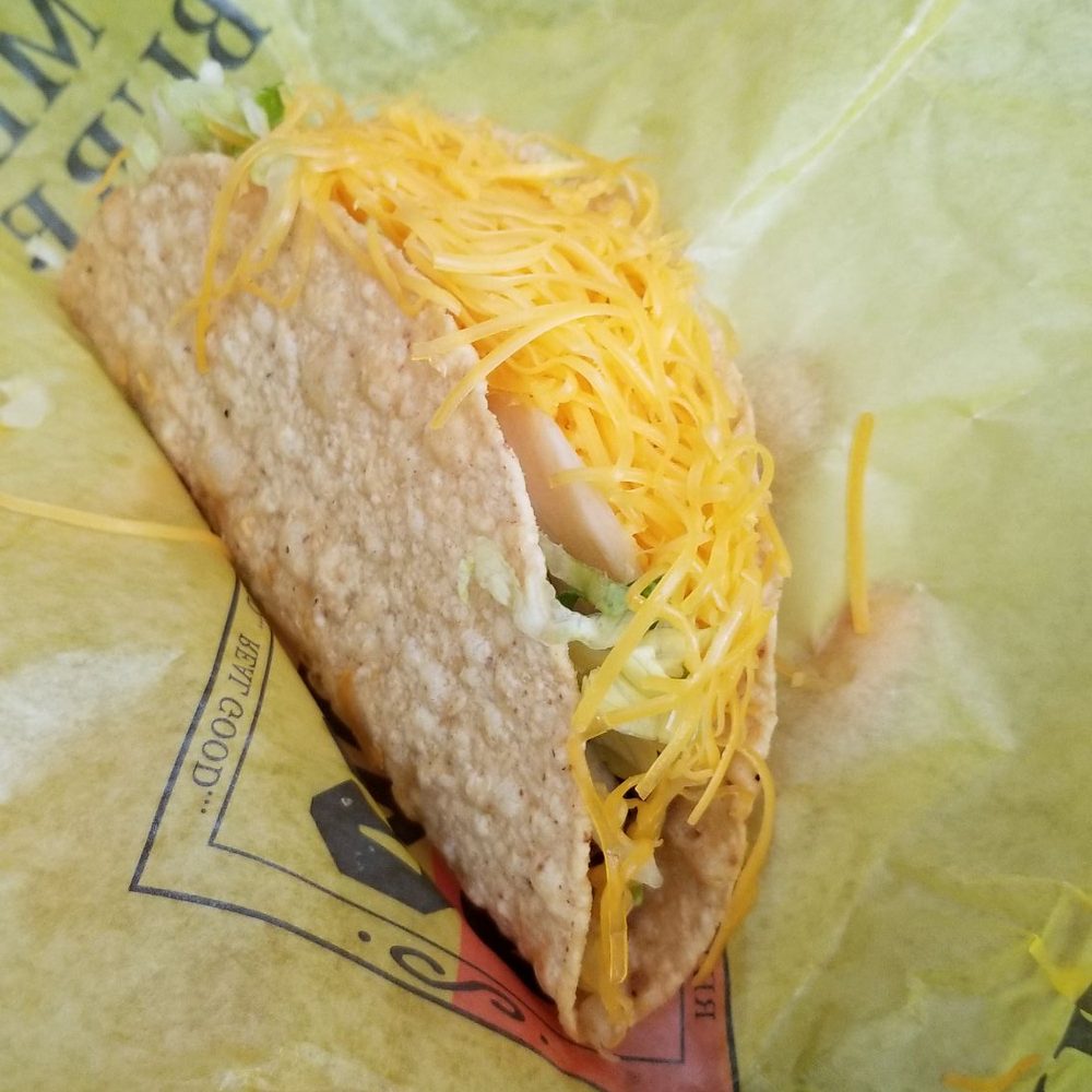 Taco Casa - a close up of a taco in a wrapper - Mexican Near Me - Rhome, Texas Taco Casa - a close up of a taco in a wrapper - Mexican Near Me - Rhome, Texas