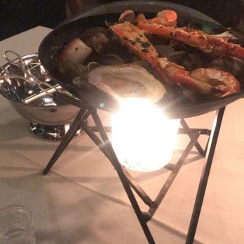 Maple & Ash - Seafood tower with oysters, clams, scallops and crab legs with freshly made pasta at the bottom. - Steakhouses Near Me - Scottsdale, Arizona