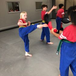 The Dojo at Downtown Cumming - Round kick target practice in After School Karate