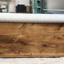 Regal Design Studio - Heirloom toy chest. Wood is refinished to match the other furniture in the home, a new padded top was added for comfort and beauty.