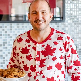 Maple Leaf Diner - Mike Delaurier, Owner in his favourite Canadian Onesie - American Near Me - Dallas, Texas Maple Leaf Diner - Mike Delaurier, Owner in his favourite Canadian Onesie - American Near Me - Dallas, Texas