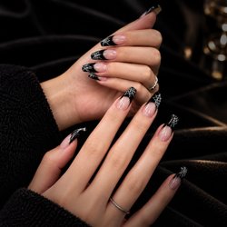 Pure Nails Spa - Spooky, sleek, and just the right amount of glam.  A chic Halloween set made to stand out at Pure Nails Spa.