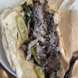Beef shawarma. Nice seasoning and enjoyed the pickled veggies with it. Beef shawarma. Nice seasoning and enjoyed the pickled veggies with it.
