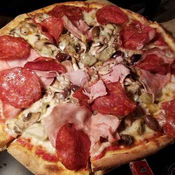 Pizzeria Bruno - Ariel view of 4 Staggioni pizza (with mixed-up ingredients) - Italian Near Me - Sutton, Massachusetts
