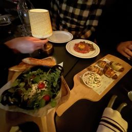 Grilled Feta (left), Ducks in Capes (right) and Steak Tartare (back right) Grilled Feta (left), Ducks in Capes (right) and Steak Tartare (back right)