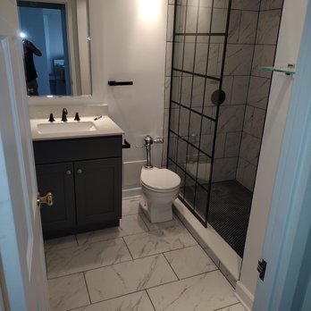 AB Home Improvements - a bathroom with a walk in shower - Painters Near Me AB Home Improvements - a bathroom with a walk in shower - Painters Near Me