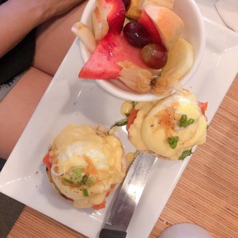Yolks - Egg Benedict with salmon, hollandaise sauce  and beet. A side fruit salad . Yum ! - Coffee & Tea Near Me - Vancouver, British Columbia
