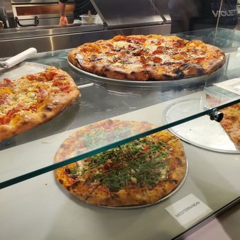 Pizzeria Violetta - Pizza by the slice in the display case - Pizza Near Me - Oakland, California Pizzeria Violetta - Pizza by the slice in the display case - Pizza Near Me - Oakland, California