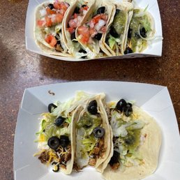 two tacos on a table two tacos on a table
