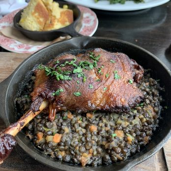 Wm Farmer & Sons - HUDSON VALLEY DUCK CONFIT Stewed Lentils, Petite Frisee Salad, Pancetta Vinaigrette - New American Near Me - Hudson, New York Wm Farmer & Sons - HUDSON VALLEY DUCK CONFIT Stewed Lentils, Petite Frisee Salad, Pancetta Vinaigrette - New American Near Me - Hudson, New York