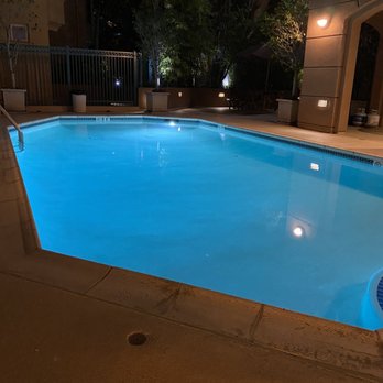 Paradise Custom Pools - After: the gorgeous, resurfaced pool at night - Pool & Hot Tub Service Near Me - Santee, California