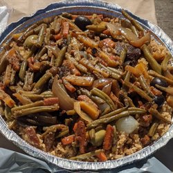 Signaar Saveurs & Services - This mouthwatering dish is composed of broken rice, topped with juicy beef and well seasoned veggies.