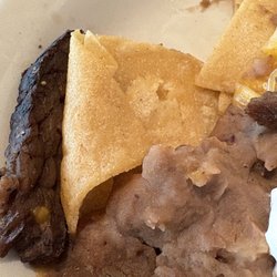 Dry fatty non cheesy pile of nachos.