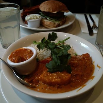 Mildreds - Creamy sweet potato and plum tomato curry with pea basmati and lime pickle - Vegan Near Me - London, XGL Mildreds - Creamy sweet potato and plum tomato curry with pea basmati and lime pickle - Vegan Near Me - London, XGL