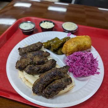 Nazareth Bread - Adana kebab platter with slaw, spinach pie, grape leaves - Mediterranean Near Me - Greensboro, North Carolina Nazareth Bread - Adana kebab platter with slaw, spinach pie, grape leaves - Mediterranean Near Me - Greensboro, North Carolina